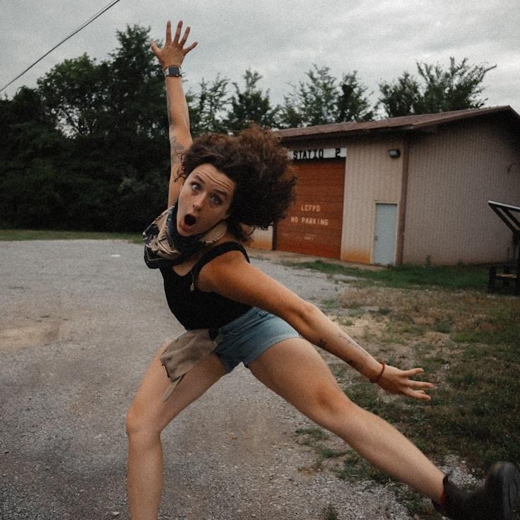 Avery Chen, Lead Design Curator at LongitudeConnectClear, reviewing corporate floral arrangements